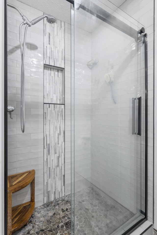 full bathroom featuring a shower stall