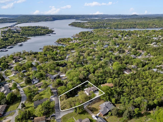 bird's eye view with a view of trees and a water view