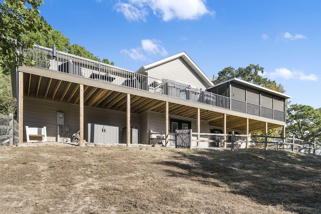 back of property featuring an exterior structure and an outbuilding