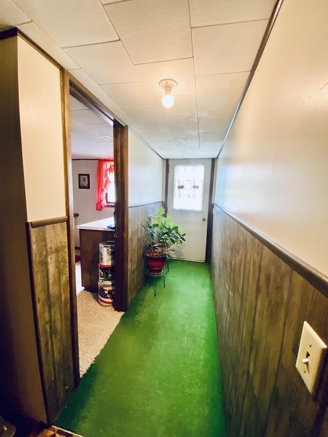 hall with wainscoting and carpet
