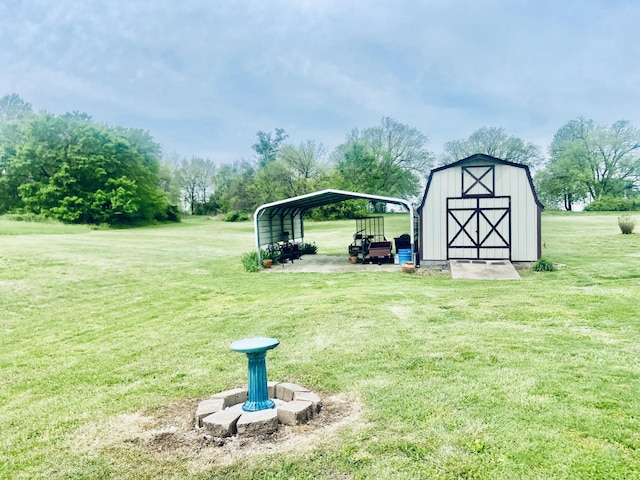 view of yard featuring an outdoor structure, a detached carport, and a storage shed