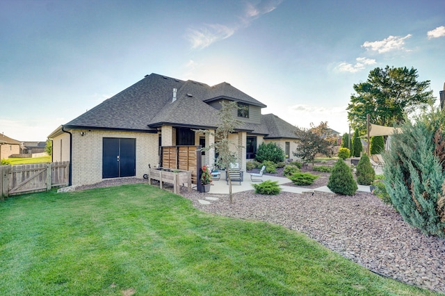 4748 Forest Trails Dr, Springfield, MO 65809 - rear view of house with a patio, a gate, a shingled roof, and brick siding