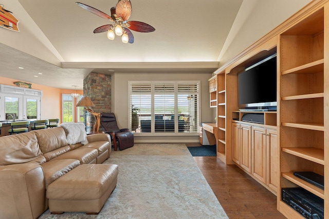 46 Wild Rose Ln, Lampe, MO 65681 - living room with dark wood finished floors and ceiling fan with notable chandelier