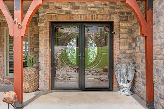 46 Wild Rose Ln, Lampe, MO 65681 - entrance to property with brick siding, french doors, and stone siding