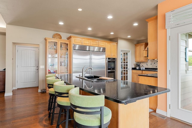 46 Wild Rose Ln, Lampe, MO 65681 - kitchen with recessed lighting, light brown cabinetry, stainless steel appliances, visible vents, and dark wood-type flooring
