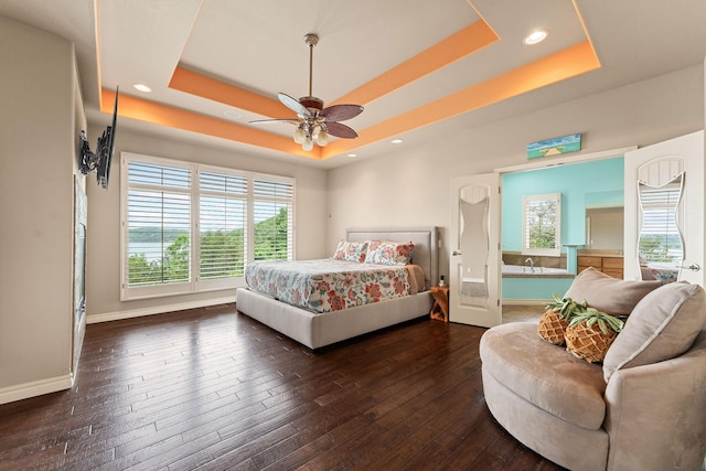 46 Wild Rose Ln, Lampe, MO 65681 - bedroom featuring dark wood-style floors, multiple windows, baseboards, and a tray ceiling