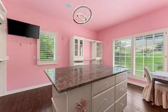 46 Wild Rose Ln, Lampe, MO 65681 - kitchen featuring dark wood-type flooring, a center island, white cabinets, and baseboards