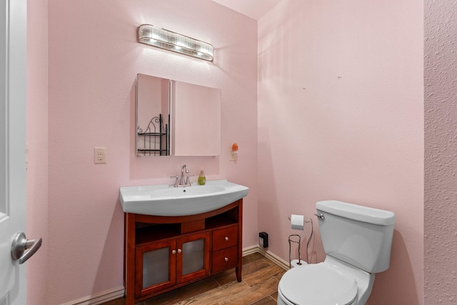 46 Wild Rose Ln, Lampe, MO 65681 - half bathroom with toilet, wood finished floors, and vanity