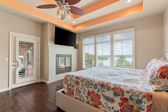 46 Wild Rose Ln, Lampe, MO 65681 - bedroom with baseboards, recessed lighting, access to exterior, and dark wood-style flooring