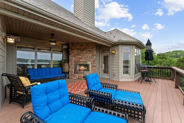 46 Wild Rose Ln, Lampe, MO 65681 - deck with ceiling fan and an outdoor living space with a fireplace