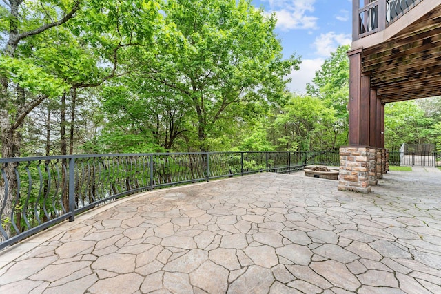 46 Wild Rose Ln, Lampe, MO 65681 - view of patio featuring an outdoor fire pit