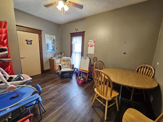 dining area with ceiling fan and wood finished floors