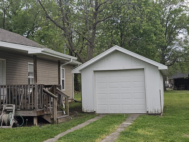 detached garage featuring driveway