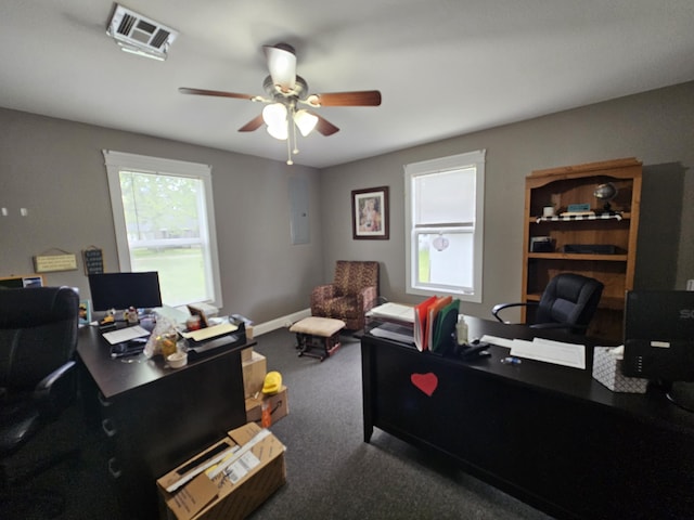 carpeted office featuring visible vents and a ceiling fan