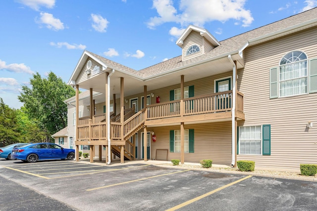 520 Abby Ln Unit 8, Branson, MO 65616 - view of property featuring uncovered parking and stairs