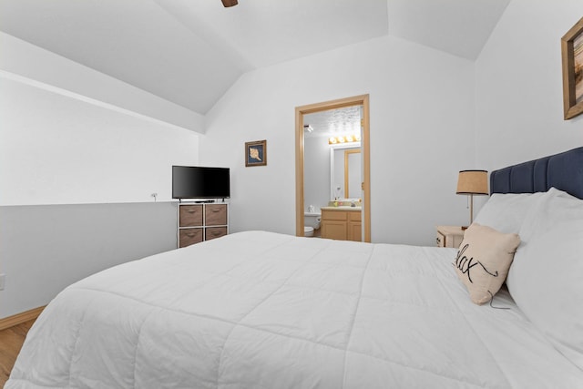 520 Abby Ln Unit 8, Branson, MO 65616 - bedroom with lofted ceiling, wood finished floors, ensuite bathroom, and ceiling fan