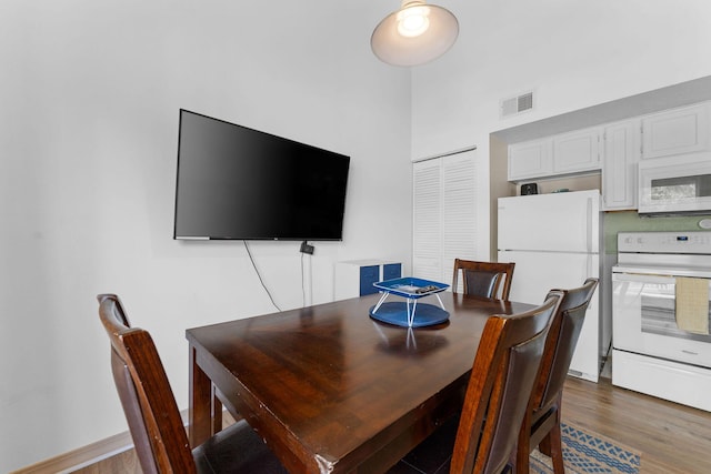520 Abby Ln Unit 8, Branson, MO 65616 - dining room with wood finished floors and a towering ceiling