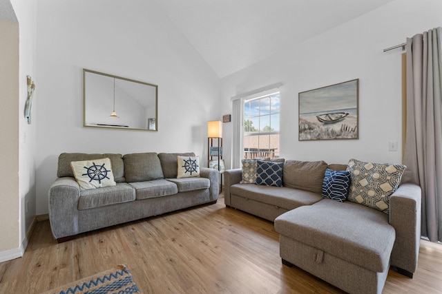 520 Abby Ln Unit 8, Branson, MO 65616 - living room featuring light wood-style floors, baseboards, and high vaulted ceiling