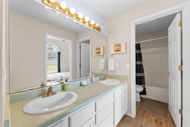 520 Abby Ln Unit 8, Branson, MO 65616 - full bathroom with toilet, wood finished floors, double vanity, ensuite bath, and shower / bath combo with shower curtain