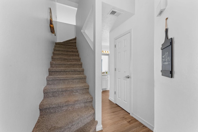 520 Abby Ln Unit 8, Branson, MO 65616 - stairs with wood finished floors
