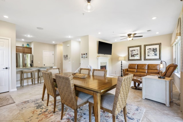 140 S Tuscany Dr Unit C, Hollister, MO 65672 - dining space featuring baseboards, recessed lighting, ceiling fan, and a fireplace
