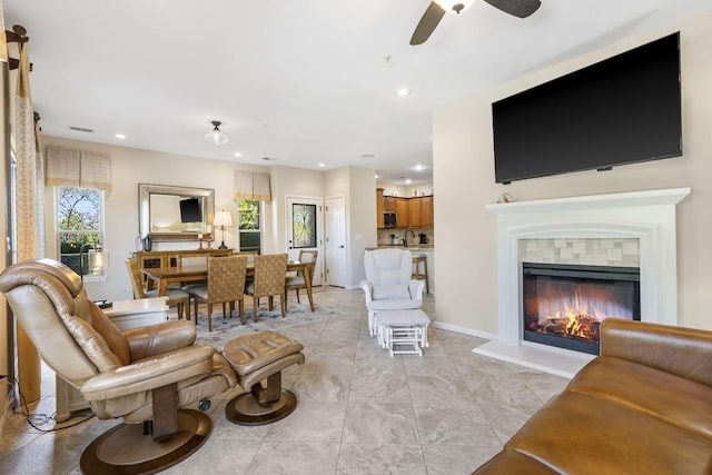140 S Tuscany Dr Unit C, Hollister, MO 65672 - living room featuring a tiled fireplace, recessed lighting, baseboards, visible vents, and a ceiling fan