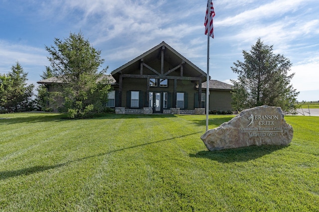 140 S Tuscany Dr Unit C, Hollister, MO 65672 - back of property with stone siding and a lawn