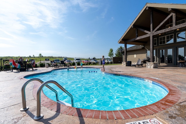 140 S Tuscany Dr Unit C, Hollister, MO 65672 - pool with fence, a patio area, and french doors