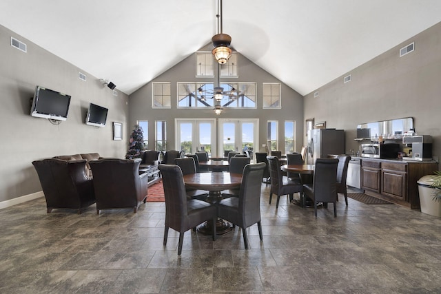140 S Tuscany Dr Unit C, Hollister, MO 65672 - dining space with visible vents, a ceiling fan, stone tile flooring, and high vaulted ceiling