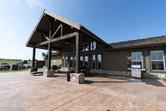 140 S Tuscany Dr Unit C, Hollister, MO 65672 - exterior space featuring a grill and fence