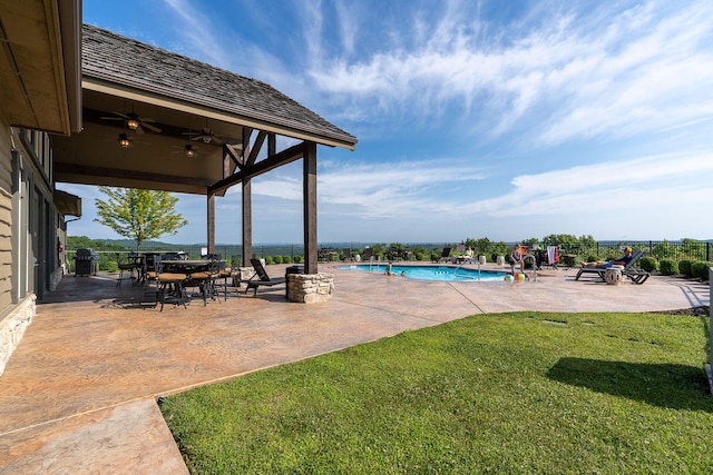 140 S Tuscany Dr Unit C, Hollister, MO 65672 - pool featuring a lawn, fence, ceiling fan, and a patio area