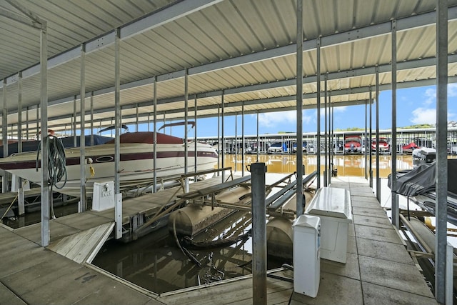 view of dock featuring a water view and boat lift