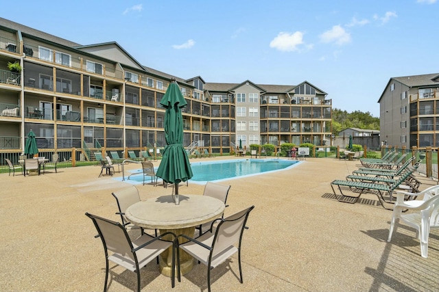 community pool featuring a patio area