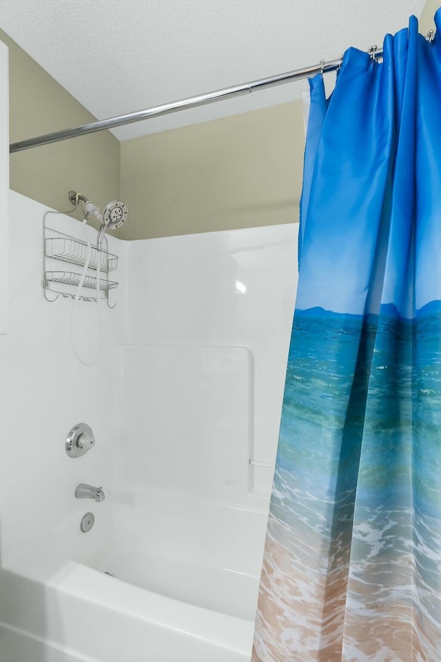full bathroom featuring shower / bath combination with curtain