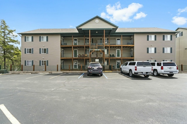 view of property featuring uncovered parking