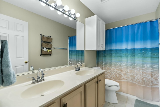 full bath featuring tile patterned floors, toilet, double vanity, and a sink