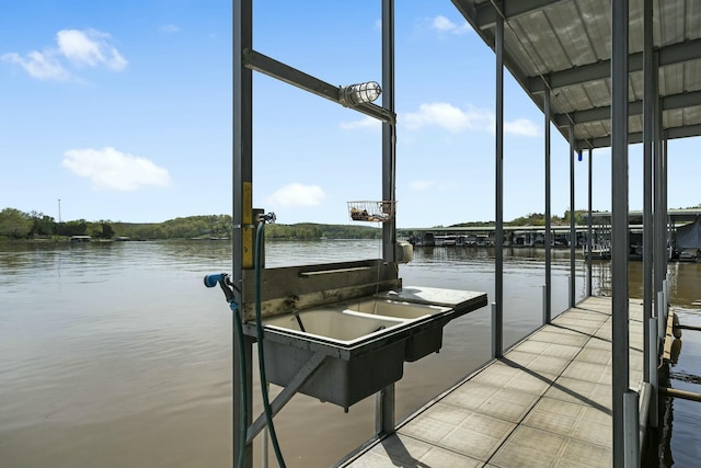 dock area featuring a water view and boat lift