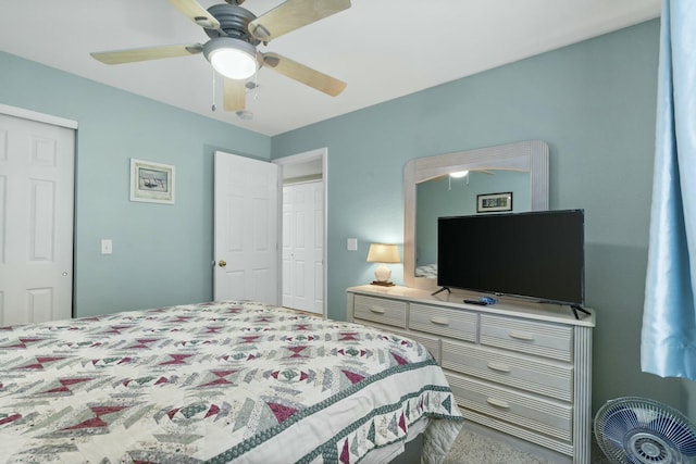 bedroom featuring a closet, ceiling fan, and carpet