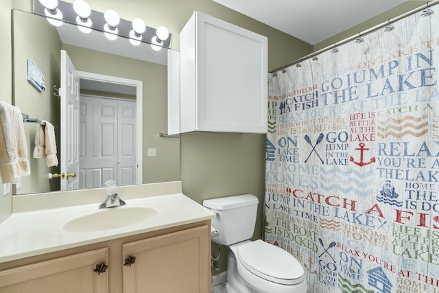 bathroom with vanity, toilet, and a shower with curtain