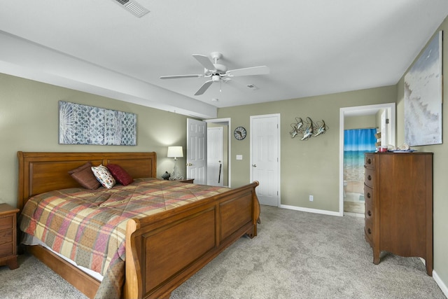 bedroom with connected bathroom, ceiling fan, visible vents, light carpet, and baseboards