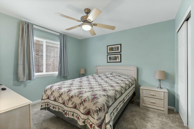 carpeted bedroom featuring ceiling fan, baseboards, and a closet
