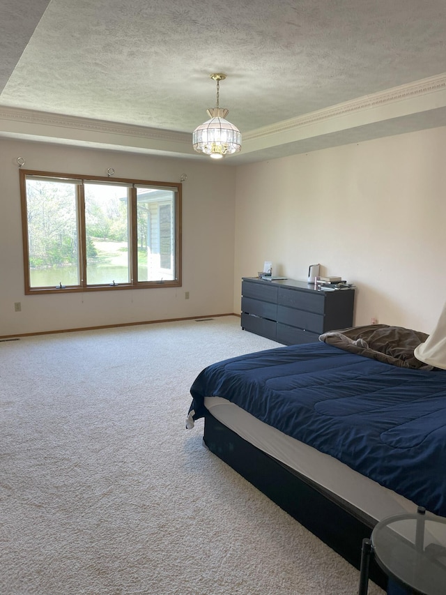 bedroom with a textured ceiling, light colored carpet, and baseboards