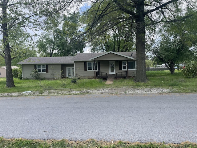 single story home with covered porch