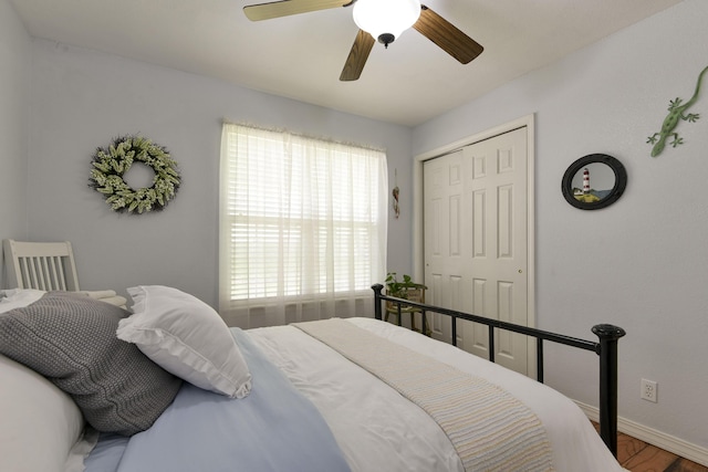 301 Oakview Dr, Ridgedale, MO 65739 - bedroom with a closet, ceiling fan, wood finished floors, and baseboards