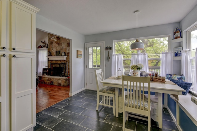 301 Oakview Dr, Ridgedale, MO 65739 - dining space with a stone fireplace and baseboards