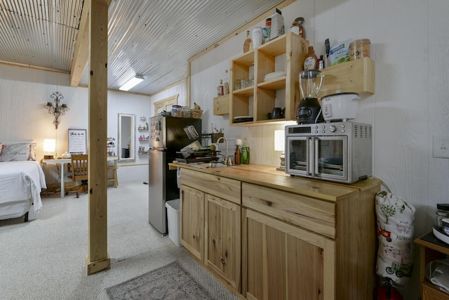 301 Oakview Dr, Ridgedale, MO 65739 - kitchen featuring light colored carpet, freestanding refrigerator, butcher block counters, a toaster, and a sink