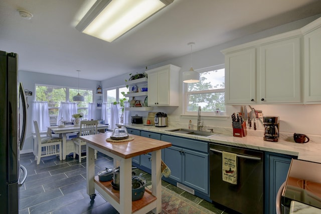 301 Oakview Dr, Ridgedale, MO 65739 - kitchen with a sink, open shelves, dishwashing machine, white cabinets, and freestanding refrigerator