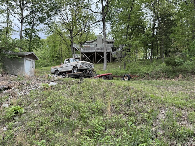 301 Oakview Dr, Ridgedale, MO 65739 - view of yard featuring a wooden deck, a shed, and an outdoor structure