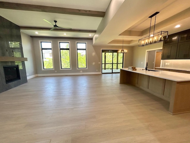 5958 S Clay Ave, Springfield, MO 65810 - kitchen with open floor plan, a chandelier, light countertops, baseboards, and recessed lighting