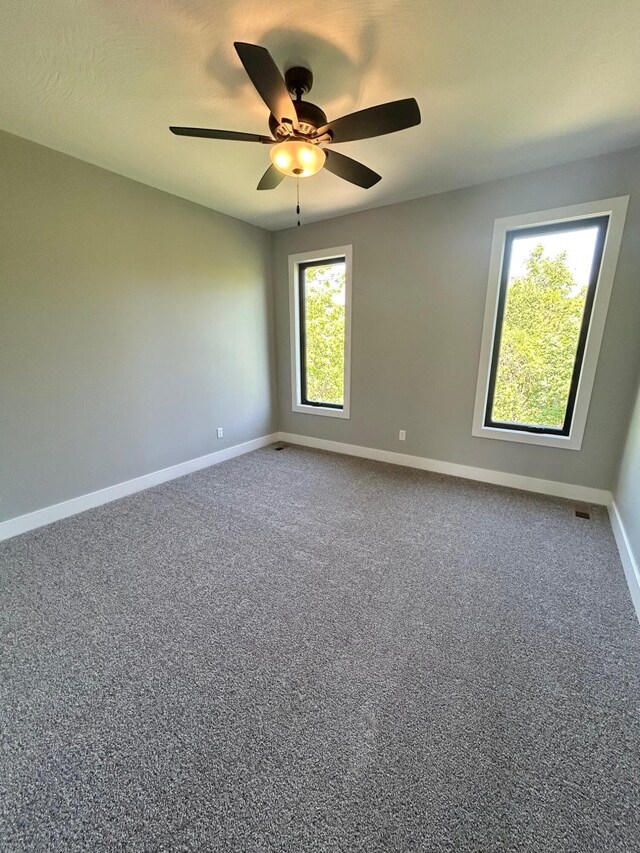 5958 S Clay Ave, Springfield, MO 65810 - spare room featuring baseboards, a ceiling fan, and carpet floors